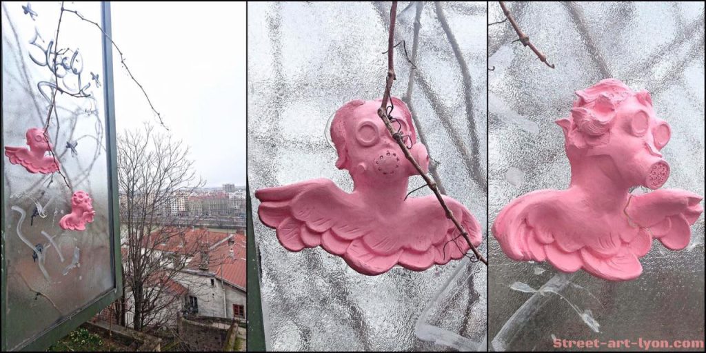 Des Chérubins avec masques à gaz... Artiste : WILL COLES Lieu : rue des fantasques ( Lyon 1er )